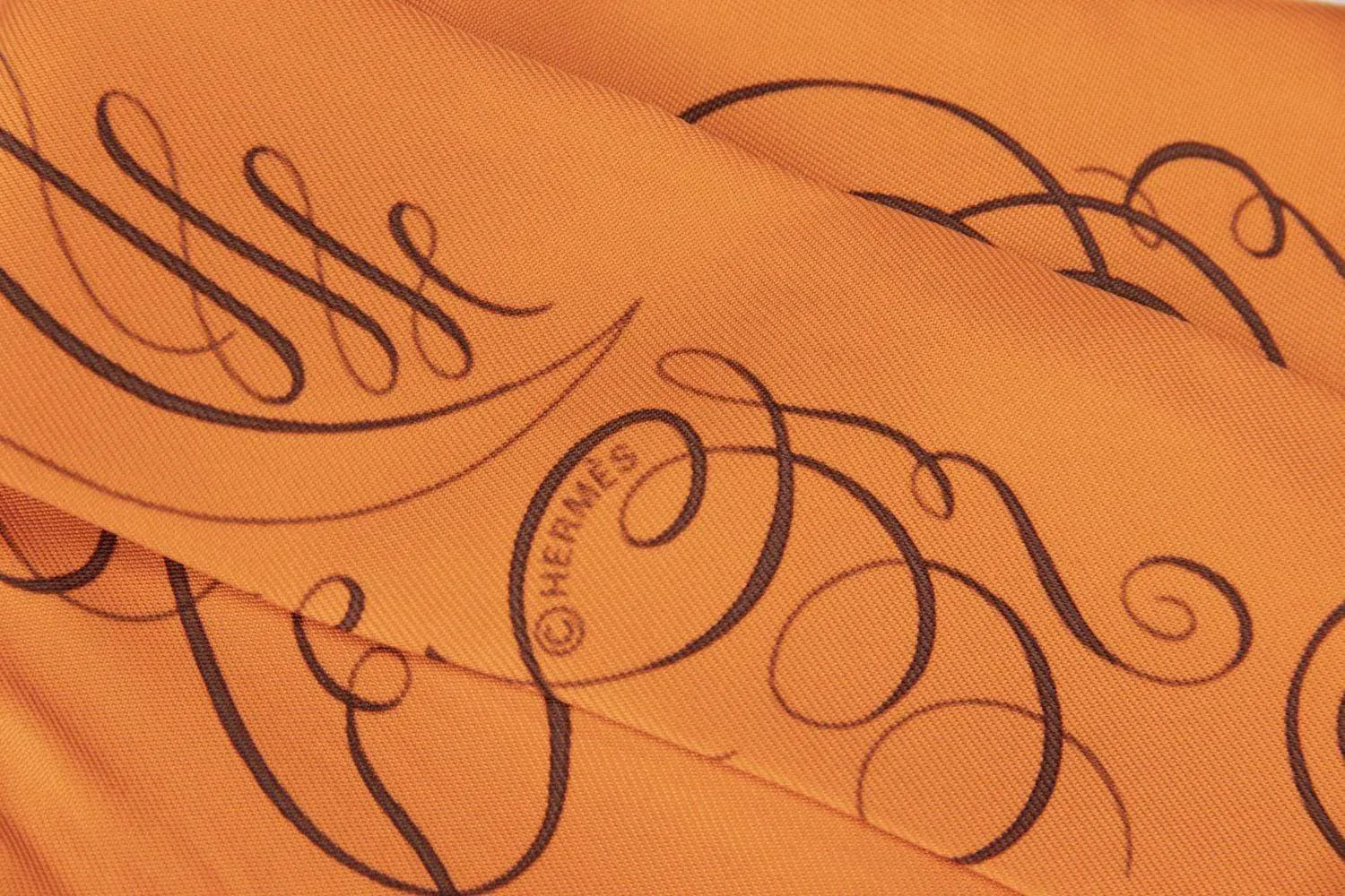 Hermes Silk Twilly Orange with Brown Caligraphy Fonts