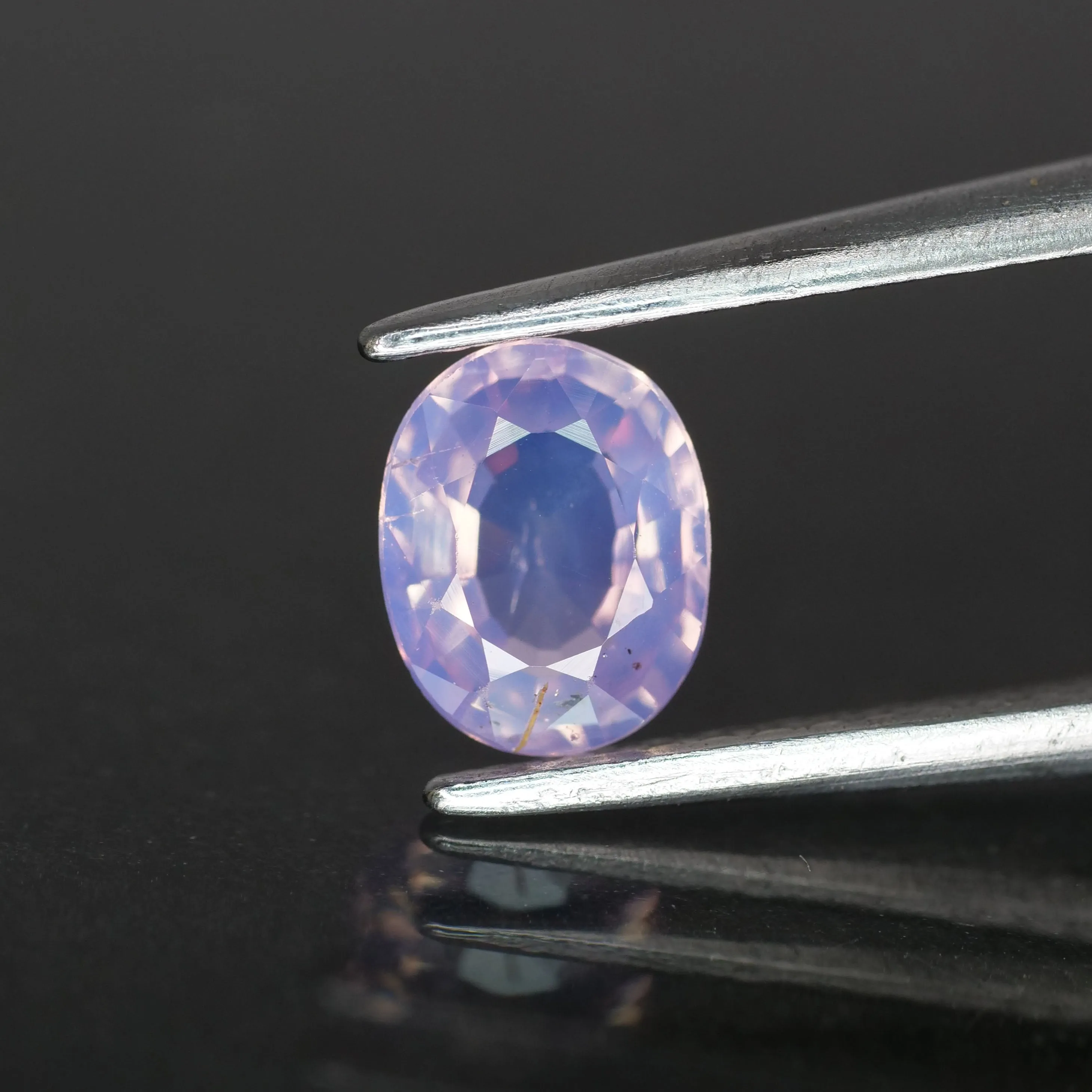 Sapphire opalescent | natural, pinkish purple, oval cut *6x5 mm, VS , 0.70ct